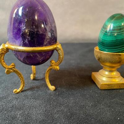 Lot 165  Two Stone eggs on stands