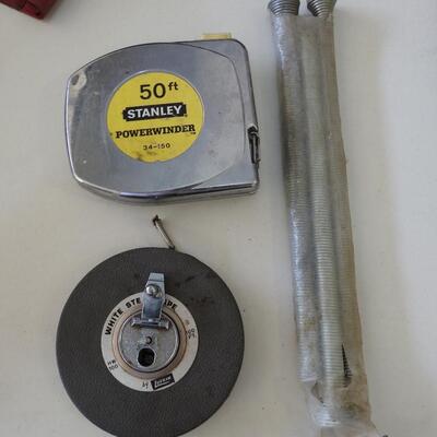 Grouping of tools tape measures and springs