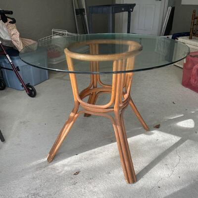 Lot 269. Glass-top Table with Rattan Base