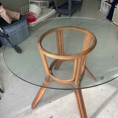 Lot 269. Glass-top Table with Rattan Base