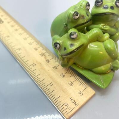 Adorable photogenic porcelain frogs