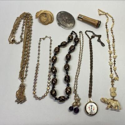 https://www.ebay.com/itm/115463819239	PO1044 VINTAGE JEWELRY LOT OF 6 NECKLACES, MIRROR, MONET PIN AND 1940s LIPSTICK 		Auction
