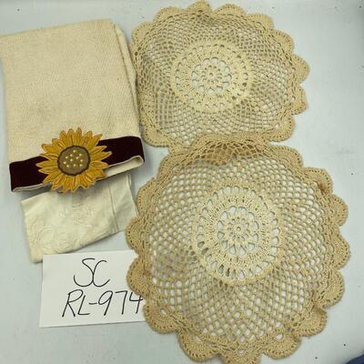 2 doilies and sunflower hand towel
