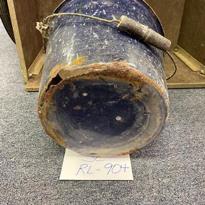 Rusty bottom blue bucket