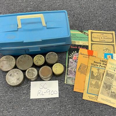 Plastic storage box with metal containers and state park memorabilia
