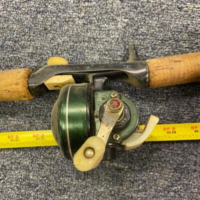 Johnson century #1008 reel and Ike Walton fiberglass rod