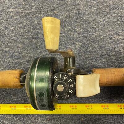 Johnson century #1008 reel and Ike Walton fiberglass rod