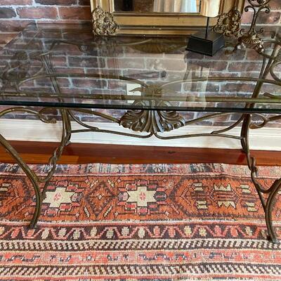 Metal table with beveled glass top.