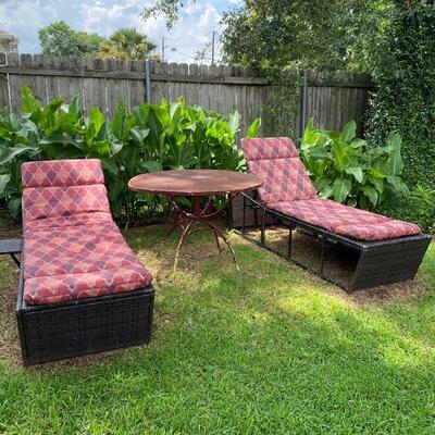 Pair of wicker patio lounge chairs with cushions, adjustable