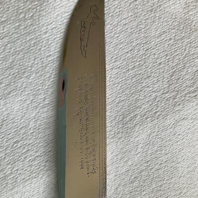 Knife with writing on blade