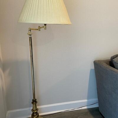 Gold colored floor lamp