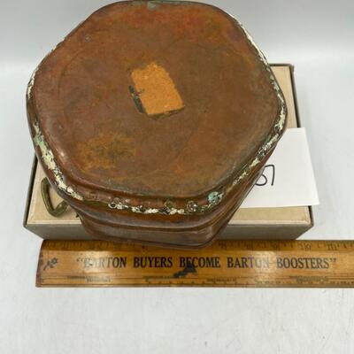 Vintage hammered copper pot with brass handles
