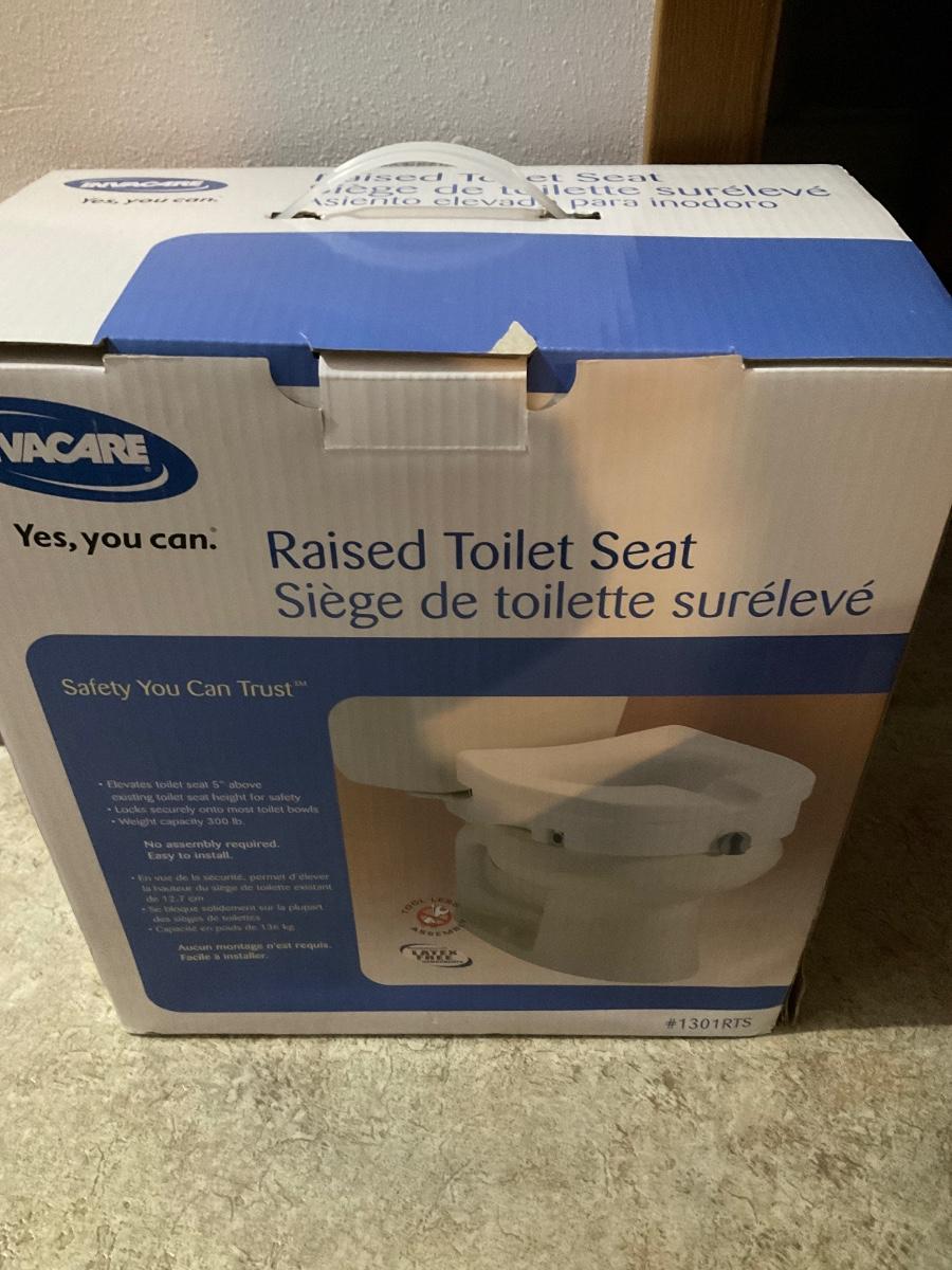 Raised toilet seat