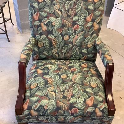 2 upholstered arm chairs with wooden legs and arms with slip covers