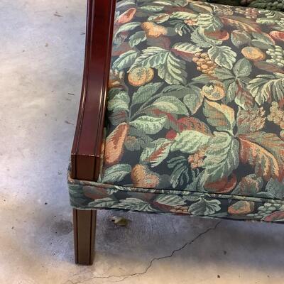 2 upholstered arm chairs with wooden legs and arms with slip covers