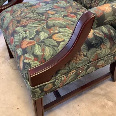 2 upholstered arm chairs with wooden legs and arms with slip covers