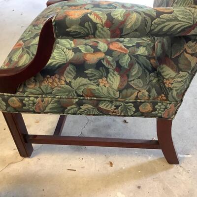 2 upholstered arm chairs with wooden legs and arms with slip covers