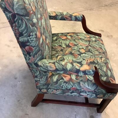 2 upholstered arm chairs with wooden legs and arms with slip covers