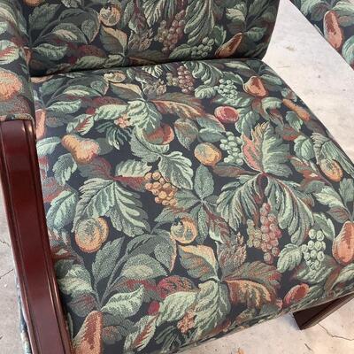 2 upholstered arm chairs with wooden legs and arms with slip covers