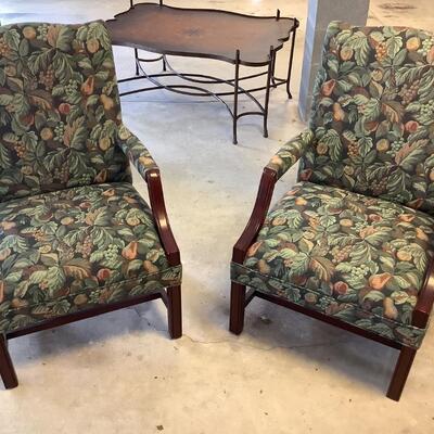 2 upholstered arm chairs with wooden legs and arms with slip covers