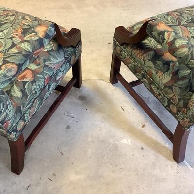 2 upholstered arm chairs with wooden legs and arms with slip covers