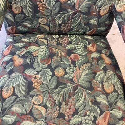 2 upholstered arm chairs with wooden legs and arms with slip covers