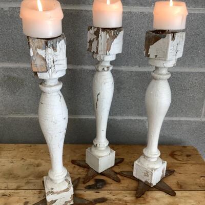 Reimagined candlesticks, wooden posts, metal stars from hurricane rods