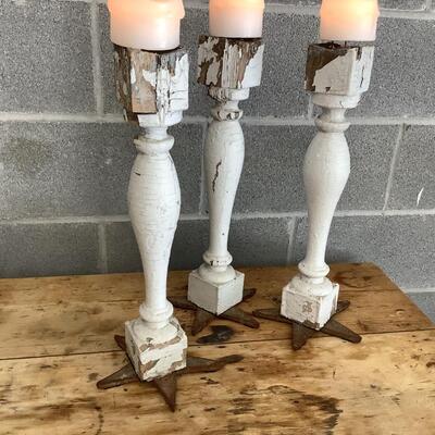 Reimagined candlesticks, wooden posts, metal stars from hurricane rods