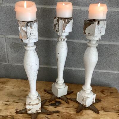 Reimagined candlesticks, wooden posts, metal stars from hurricane rods