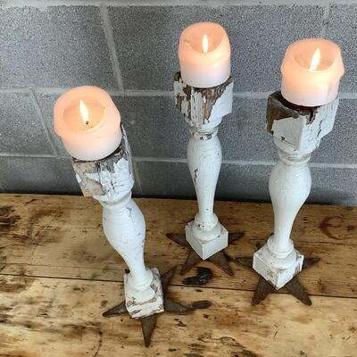 Reimagined candlesticks, wooden posts, metal stars from hurricane rods