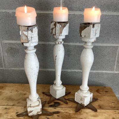 Reimagined candlesticks, wooden posts, metal stars from hurricane rods