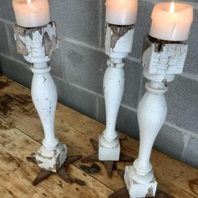 Reimagined candlesticks, wooden posts, metal stars from hurricane rods