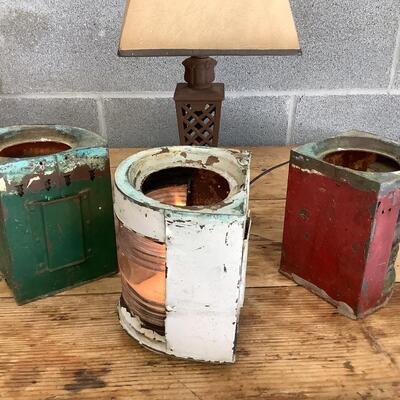Vintage Bow & stern running lights shown with candles and a lamp