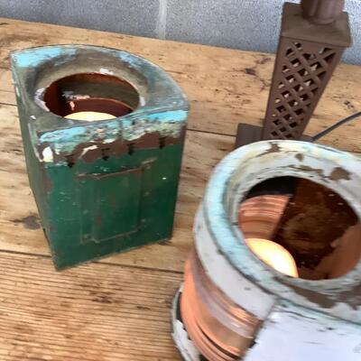 Vintage Bow & stern running lights shown with candles and a lamp