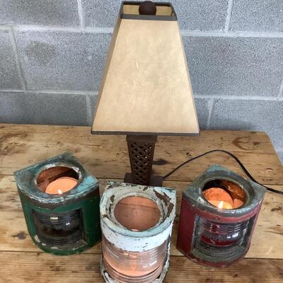 Vintage Bow & stern running lights shown with candles and a lamp