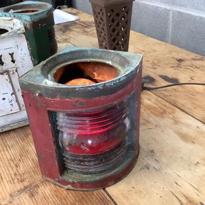 Vintage Bow & stern running lights shown with candles and a lamp