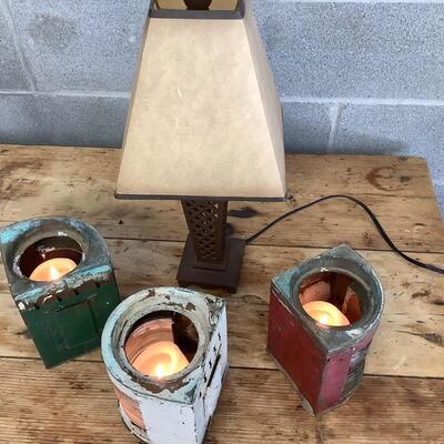 Vintage Bow & stern running lights shown with candles and a lamp
