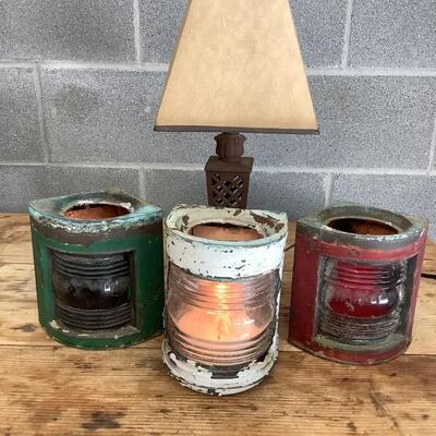 Vintage Bow & stern running lights shown with candles and a lamp