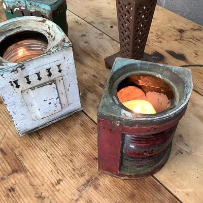 Vintage Bow & stern running lights shown with candles and a lamp