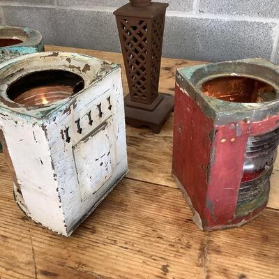 Vintage Bow & stern running lights shown with candles and a lamp