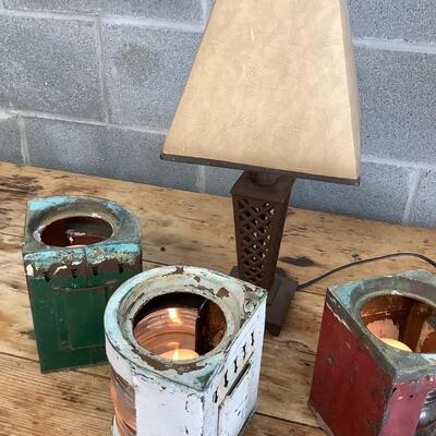 Vintage Bow & stern running lights shown with candles and a lamp