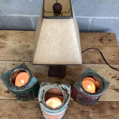 Vintage Bow & stern running lights shown with candles and a lamp
