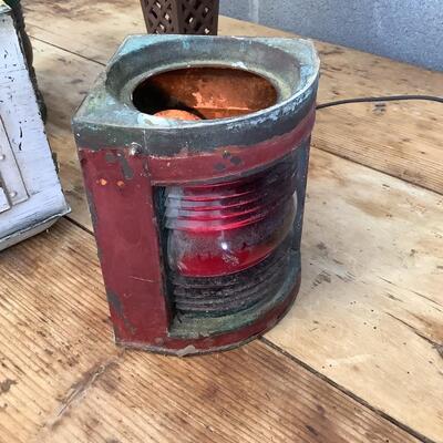 Vintage Bow & stern running lights shown with candles and a lamp