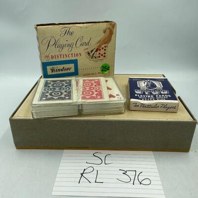 Vintage woven funeral home fan and some playing cards