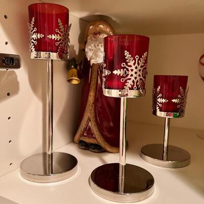 wine goblets with red swirls, green plates set white dinner plates and mugs