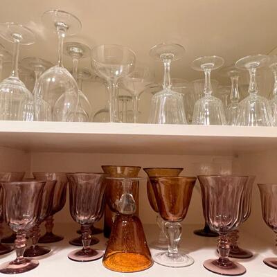 Clear and colored wine glasses and goblets, drinking glasses