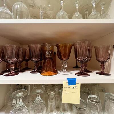 Clear and colored wine glasses and goblets, drinking glasses
