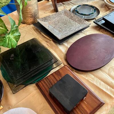 magazine holder with Art books, artificial plants, displays,  and stands