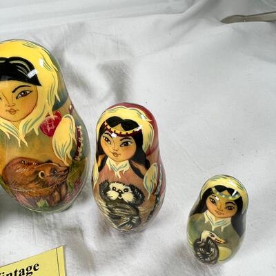 Five hand painted one of a kind Russian nesting dolls, signed