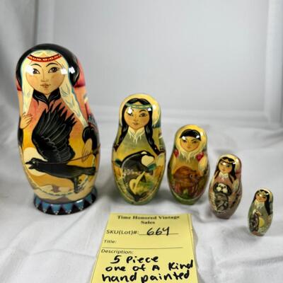Five hand painted one of a kind Russian nesting dolls, signed